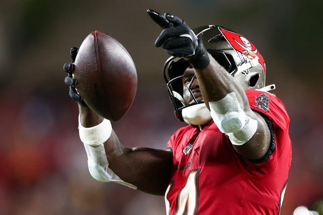 Oct 21, 2024; Tampa, Florida, USA; Tampa Bay Buccaneers wide receiver Chris Godwin (14) celebrates a first down against the Baltimore Ravens in the second quarter at Raymond James Stadium. Mandatory Credit: Nathan Ray Seebeck-Imagn Images/File Photo
