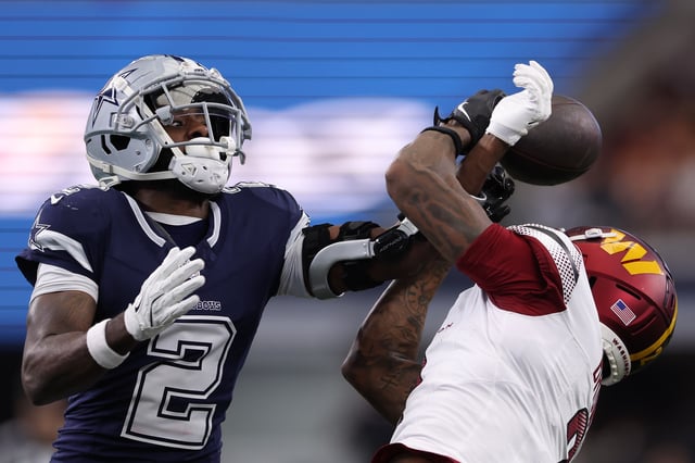 ARLINGTON, TEXAS - JANUARY 05: Jourdan Lewis #2 of the Dallas Cowboys defends a pass intended for Dyami Brown #2 of the Washington Commanders during the second quarter at AT&amp;T Stadium on January 05, 2025 in Arlington, Texas.