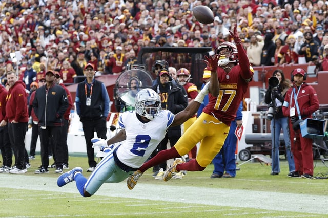 Nov 24, 2024; Landover, Maryland, USA; Washington Commanders wide receiver Terry McLaurin (17) attempts to make a catch as Dallas Cowboys cornerback Jourdan Lewis (2) defends during the second quarter at Northwest Stadium. Mandatory Credit: Geoff Burke-Imagn Images/File Photo