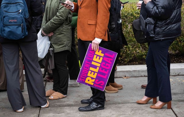 Activists and students protest in front of the Supreme Court during a rally for student debt cancellation in Washington, D.C., on February 28, 2023.