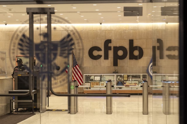 A security officer works inside of the Consumer Financial Protection Bureau (CFPB) building headquarters Monday, Feb. 10, 2025, in Washington. (AP Photo/Jacquelyn Martin)