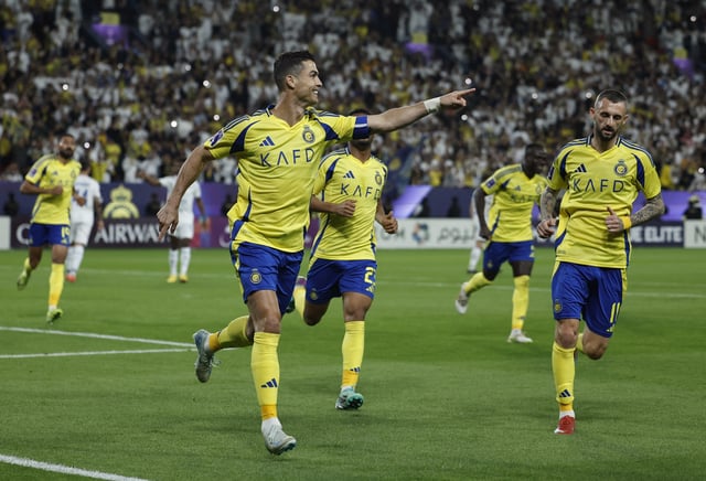 Soccer Football - Asian Champions League - Round of 16 - Second Leg - Al Nassr v Esteghlal - Al Awwal Park, Riyadh, Saudi Arabia - March 10, 2025 Al Nassr's Cristiano Ronaldo celebrates scoring their second goal with teammates REUTERS/Hamad I Mohammed