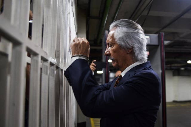 Journalist Jose Ruben Zamora Marroquin reacts in handcuffs after a judge revoked his house arrest, ordering his return to Mariscal Zavala prison in Guatemala City, Guatemala, March 10, 2025. REUTERS/Cristina Chiquin