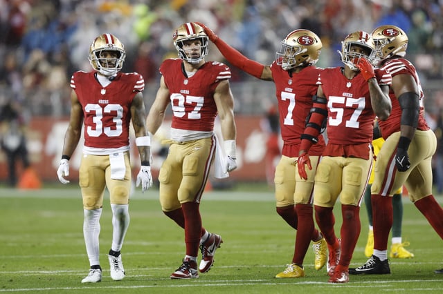 SANTA CLARA, CALIFORNIA - JANUARY 20: Nick Bosa #97 of the San Francisco 49ers is congratulated by Charvarius Ward #7 after a defensive stop during the first quarter against the Green Bay Packers in the NFC Divisional Playoffs at Levi&#39;s Stadium on January 20, 2024 in Santa Clara, California.