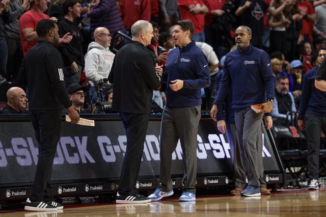 Dec 30, 2024; Piscataway, New Jersey, USA; Rutgers Scarlet Knights head coach Steve Pikiell, left. talks with Columbia Lions head coach Jim Engles after the game at Jersey Mike's Arena. Mandatory Credit: Vincent Carchietta-Imagn Images/File Photo
