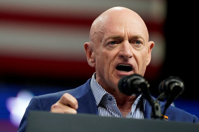 Senator Mark Kelly (D-AZ) speaks during a campaign rally held along with U.S. Vice President and Democratic presidential candidate Kamala Harris and Democratic vice presidential candidate, Minnesota Governor Tim Walz, in Glendale, Arizona, U.S., August 9, 2024. REUTERS/Elizabeth Frantz/File Photo