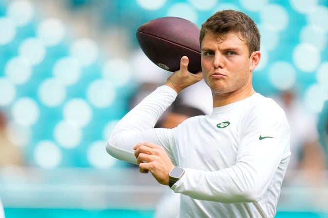 Zach Wilson hopes to shake his New York Jets days after signing with the Miami Dophins on Monday. (Photo by Rich Storry/Getty Images)
