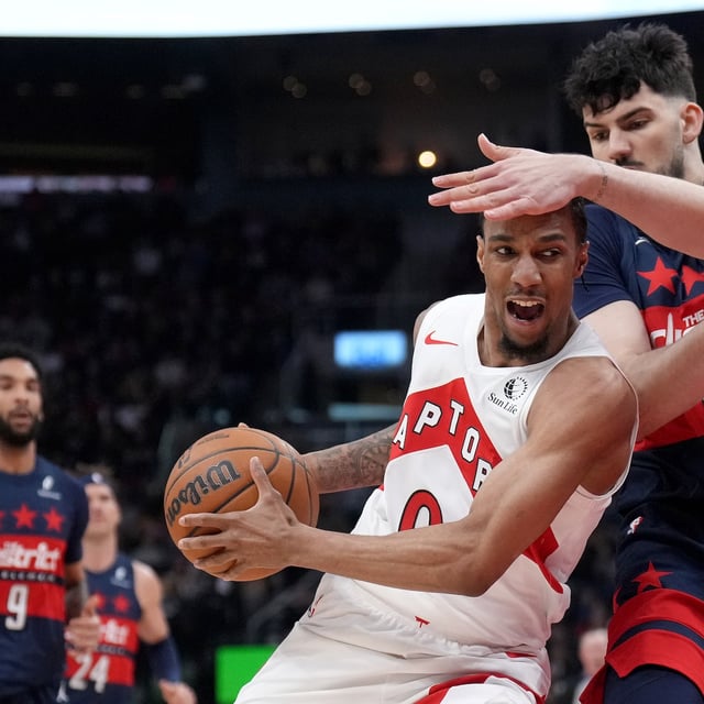 Toronto Raptors guard A.J. Lawson (0) and Washington Wizards forward Tristan Vukcevic (00) collide during first half NBA basketball action in Toronto, Monday, March 10, 2025. THE CANADIAN PRESS/Nathan Denette