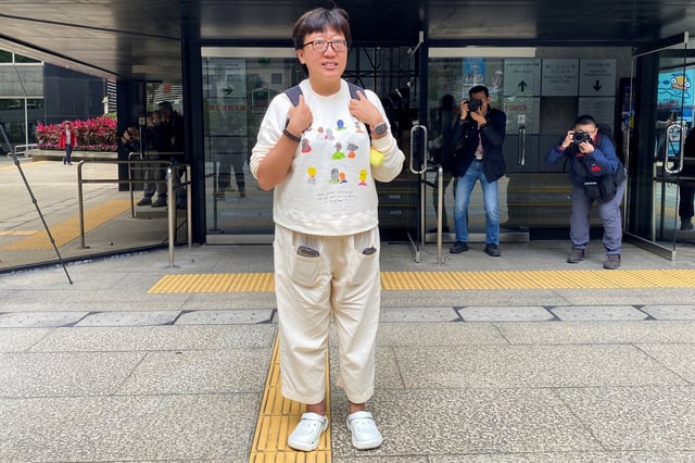 Social worker Jackie Chen Hung-sau arrives at the district court ahead of the verdict in her rioting retrial, in Hong Kong, China March 11, 2025. REUTERS/Jessie Pang