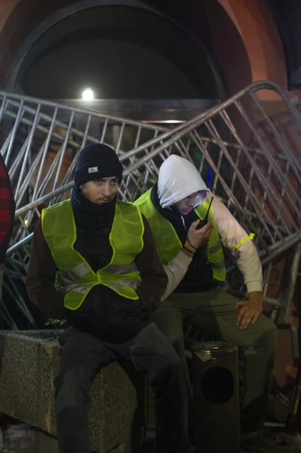 Students block the entrance to the public broadcaster RTS building with barricades in central Belgrade, Serbia, early Tuesday, March 11, 2025. (AP Photo/Marko Drobnjakovic)