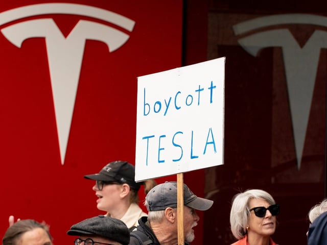 Demonstrators protesting against Elon Musk and electric car maker Tesla on February 22, 2025, in Seattle, Washington.