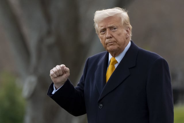 President Donald Trump pumps his fist before departing on Marine One from the South Lawn of the White House, Friday, March 7, 2025, in Washington.