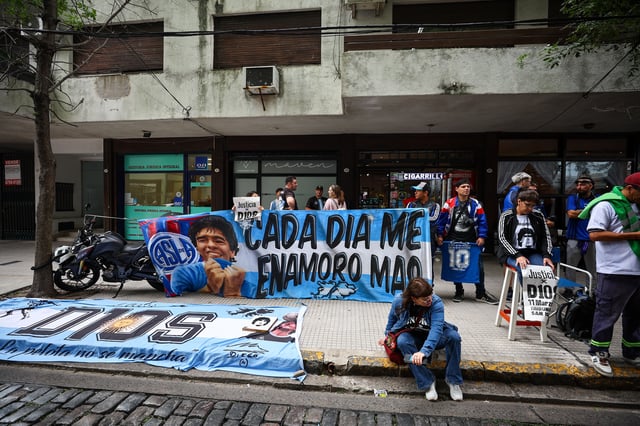 Fans of Argentine soccer legend Diego Armando Maradona gather, on the day of a court case against people charged with Maradona's death, in Buenos Aires, Argentina, March 11, 2025. REUTERS/Agustin Marcarian