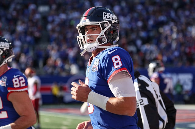 Nov 3, 2024; East Rutherford, New Jersey, USA; New York Giants quarterback Daniel Jones (8) runs of fetch field after throwing a touchdown pass during the first half against the Washington Commanders at MetLife Stadium. Mandatory Credit: Vincent Carchietta-Imagn Images/File Photo