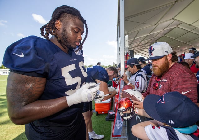 Jul 30, 2023; Houston, TX, USA; Houston Texans guard Kenyon Green (59) signs autographs for fans after training camp practice at the Houston Methodist Training Center. Mandatory Credit: Thomas Shea-USA TODAY Sports/File Photo