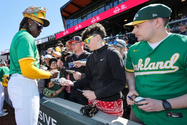LAS VEGAS, NEVADA - MARCH 09: Lawrence Butler #4 of the Athletics signs autographs for fans before a spring training game against the Arizona Diamondbacks at Las Vegas Ballpark on March 09, 2025 in Las Vegas, Nevada. The Diamondbacks defeated the Athletics 7-5. (Photo by Ethan Miller/Getty Images)