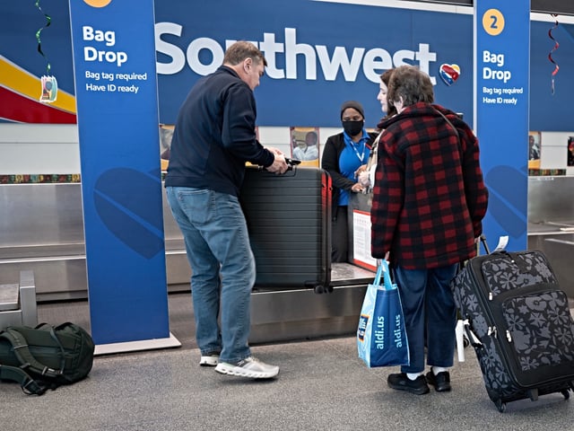 CHICAGO, ILLINOIS - FEBRUARY 18: Passengers check in for Southwest Airlines flights at Chicago Midway International Airport on February 18, 2025 in Chicago, Illinois. The airline said it plans to layoff 1,750 employees, marking the first broad layoffs in the company's history. (Photo by Scott Olson/Getty Images)