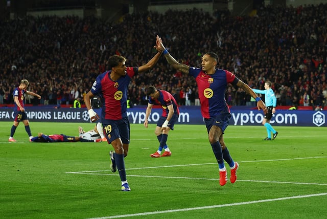 Soccer Football - Champions League - Round of 16 - Second Leg - FC Barcelona v Benfica - Estadi Olimpic Lluis Companys, Barcelona, Spain - March 11, 2025 FC Barcelona's Raphinha celebrates scoring their third goal with Lamine Yamal REUTERS/Albert Gea