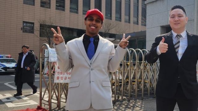 johnny somali outside south korean court