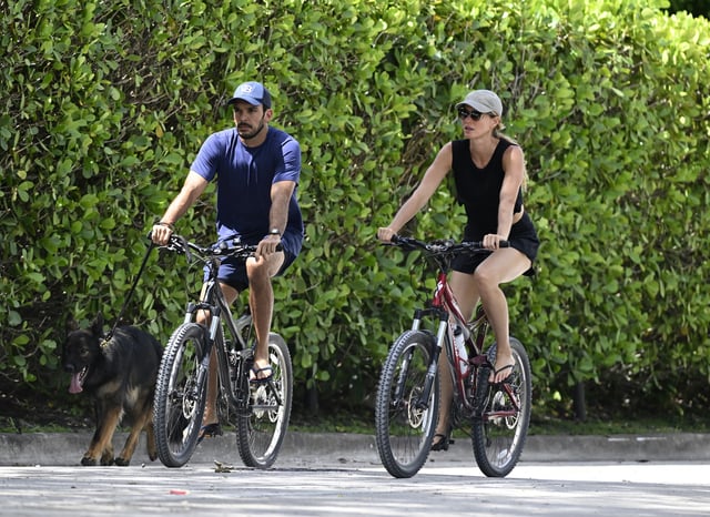 Joaquim Valente and Gisele Bündchen are seen on a bike ride on July 14, 2024 in Surfside, Florida.
