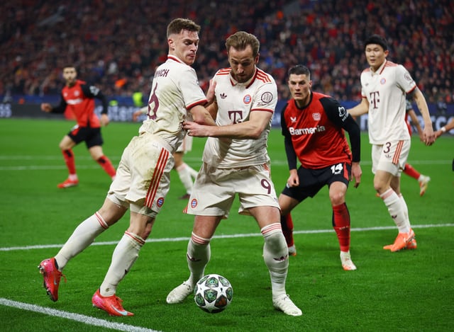Soccer Football - Champions League - Round of 16 - Second Leg - Bayer Leverkusen v Bayern Munich - BayArena, Leverkusen, Germany - March 11, 2025 Bayern Munich's Harry Kane in action with Bayern Munich's Joshua Kimmich REUTERS/Thilo Schmuelgen