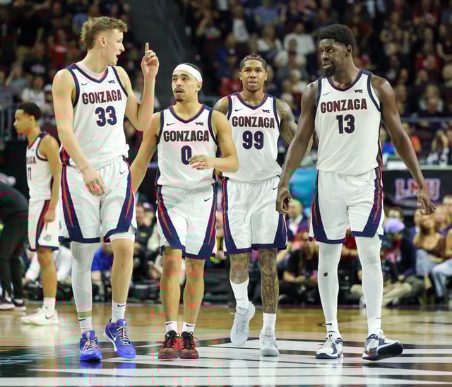 Ben Gregg #33, Ryan Nembhard #0, Khalif Battle #99 and Graham Ike #13 of the Gonzaga Bulldogs walk on the court during a break in the second half of a semifinal game of the West Coast Conference men&#39;s basketball tournament against the San Francisco Dons at the Orleans Arena on March 10, 2025 in Las Vegas, Nevada.