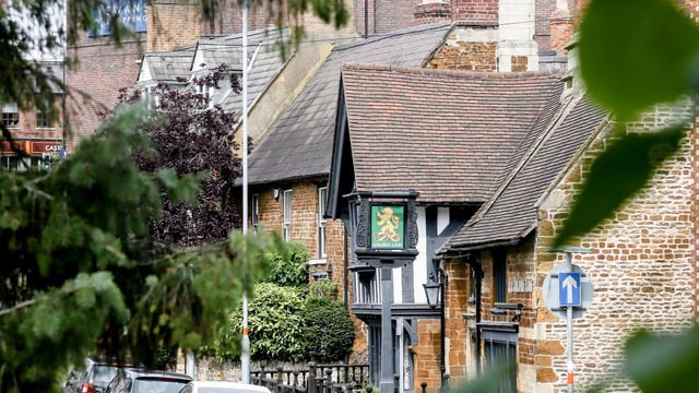 The woman was found after a house fire in Wellingborough