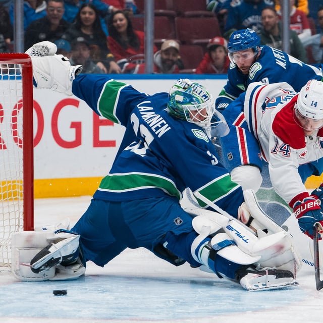 Mar 11, 2025; Vancouver, British Columbia, CAN; Vancouver Canucks defenseman Marcus Pettersson (29) watches as Montreal Canadiens forward Nick Suzuki (14) scores on goalie Kevin Lankinen (32) in the first period at Rogers Arena. Mandatory Credit: Bob Frid-Imagn Images