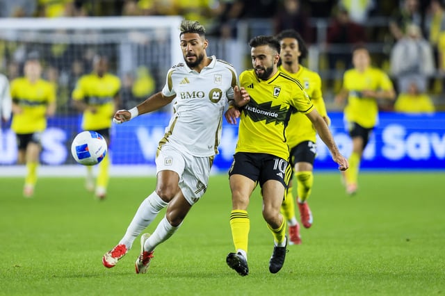 Mar 11, 2025; Columbus, Ohio, USA; Los Angeles FC forward Denis Bouanga (99) battles for the ball against Columbus Crew forward Diego Rossi (10) in the second half at Lower.com Field. Mandatory Credit: Katie Stratman-Imagn Images
