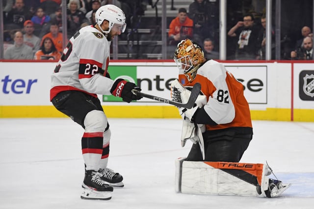 Mar 11, 2025; Philadelphia, Pennsylvania, USA; Philadelphia Flyers goaltender Ivan Fedotov (82) makes a save against Ottawa Senators right wing Michael Amadio (22) during the second period at Wells Fargo Center. Mandatory Credit: Eric Hartline-Imagn Images