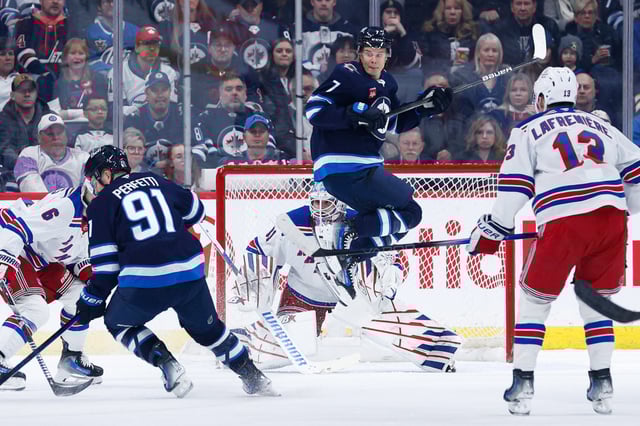 Mar 11, 2025; Winnipeg, Manitoba, CAN;  Winnipeg Jets forward Vladislav Namestnikov (7) screens New York Rangers goalie Igor Shesterkin (31) during the first period at Canada Life Centre. Mandatory Credit: Terrence Lee-Imagn Images