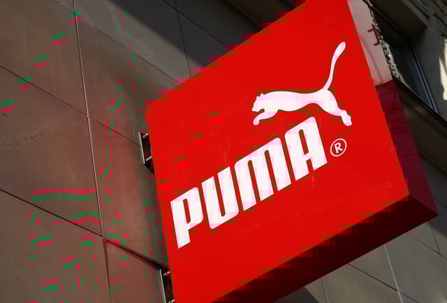 The logo of German sports goods firm Puma is seen at the entrance of one of its stores in Vienna, Austria, March 18, 2016.   REUTERS/Leonhard Foeger/File Photo
