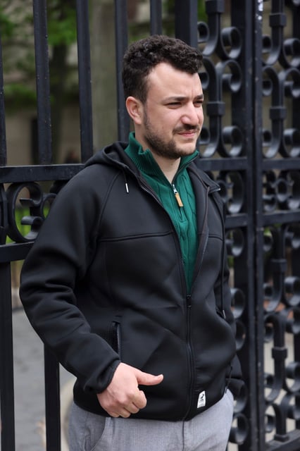 Mahmoud Khalil, then a 29-year-old graduate student at Columbia University, stands outside the gates of the campus in New York City on April 30, 2024.