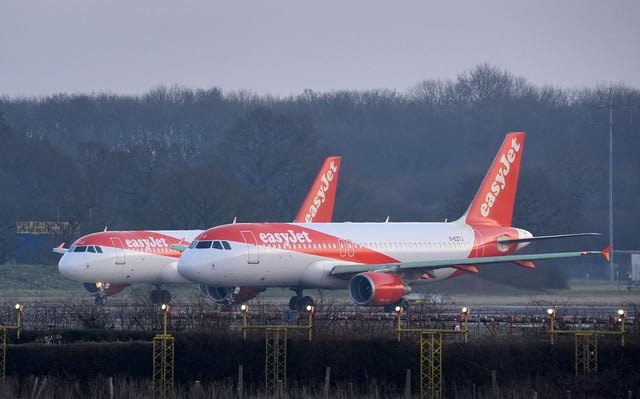 EasyJet planes queue to take off at London Gatwick Airport in Crawley, West Sussex. Gatwick wants to bring its second, emergency runway into routine use for take-offs by smaller aircraft, increasing the airport's annual flight capacity by 100,000. Opponents of the expansion have accused the airport of trying to open "a new runway on the cheap". Picture date: Monday February 17, 2025. PA Photo. See PA story AIR Gatwick. Photo credit should read: Gareth Fuller/PA Wire
 