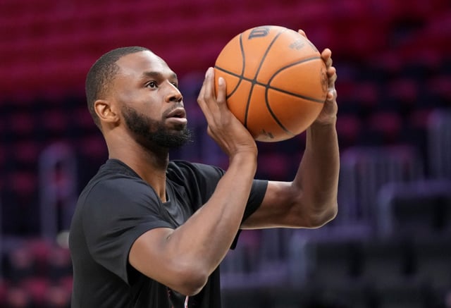 Miami Heat forward Andrew Wiggins warms up before an NBA basketball game against the Boston Celtics Monday, Feb. 10, 2025, in Miami. (AP Photo/Lynne Sladky)