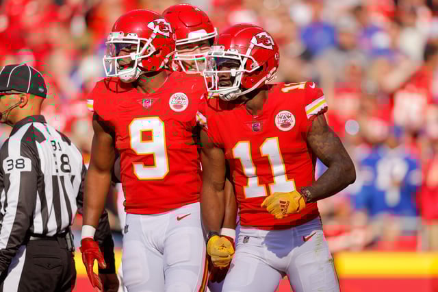JuJu Smith-Schuster #9 of the Kansas City Chiefs and Marquez Valdes-Scantling #11 of the Kansas City Chiefs react to a first quarter penalty call that negated a touchdown catch by Valdez-Scantling against the Buffalo Bills at Arrowhead Stadium.