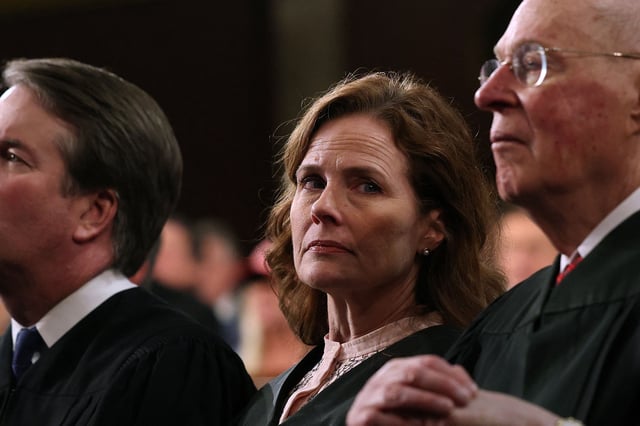 Justice Brett Kavanaugh, Justice Amy Coney Barrett and retired Supreme Court Justice Anthony Kennedy listen as US President Donald Trump addresses a joint session of Congress at the US Capitol in Washington, DC, on March 4, 2025. (Photo by Win McNamee / POOL / AFP) (Photo by WIN MCNAMEE/POOL/AFP via Getty Images)