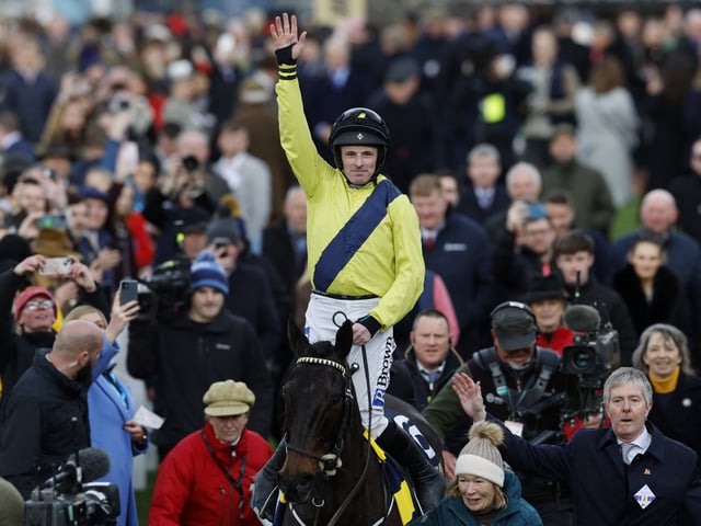 Horse Racing - Cheltenham Festival - Cheltenham Racecourse, Cheltenham, Britain - March 12, 2025 Sean Flanagan riding Marine Nationale celebrates after winning the 16:00 BetMGM Queen Mother Champion Chase REUTERS/Peter Cziborra
