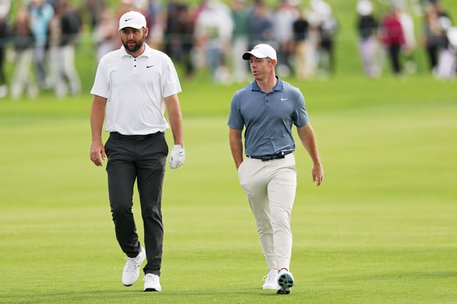 LA JOLLA, CALIFORNIA - FEBRUARY 16: Scottie Scheffler of the United States (L) and Rory McIlroy of Northern Ireland walk across the 15th hole during the final round of The Genesis Invitational 2025 at Torrey Pines Golf Course on February 16, 2025 in La Jolla, California.