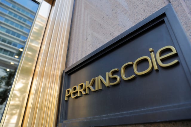 Signage is seen outside of the law firm Perkins Coie at their legal offices in Washington, D.C., U.S., May 10, 2021. REUTERS/Andrew Kelly/File Photo