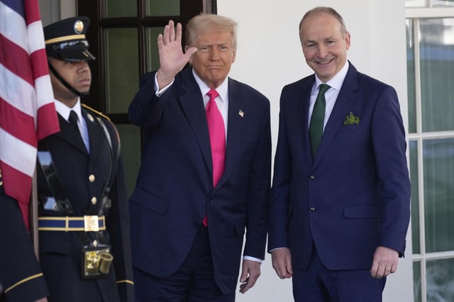 Ireland's Prime Minister Michael Martin is greeted by President Donald Trump as he arrives at the West Wing of the White House in Washington, Wednesday, March 12, 2025. (AP Photo/Ben Curtis)