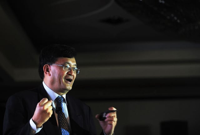 Cadence Design CEO Lip-Bu Tan delivers the key-note address during the CDN Live conference in Bangalore on November 19, 2009. CDN Live is a global series of events bringing together electronics designers and engineers using Cadence products. AFP PHOTO/Dibyangshu SARKAR (Photo credit should read DIBYANGSHU SARKAR/AFP via Getty Images)