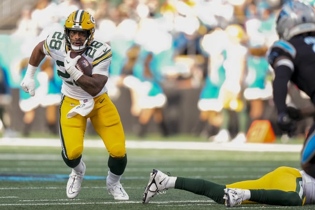 Dec 24, 2023; Charlotte, North Carolina, USA; Green Bay Packers running back AJ Dillon (28) runs for yardage against the Carolina Panthers during the second half at Bank of America Stadium. Mandatory Credit: Jim Dedmon-USA TODAY Sports/File Photo