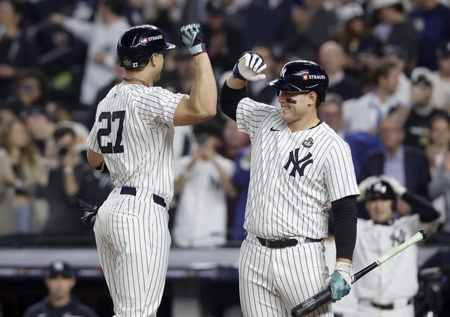 NEW YORK, NEW YORK - OCTOBER 30: (NEW YORK DAILIES OUT) Giancarlo Stanton #27 and Anthony Rizzo 48 of the New York Yankees in action against the Los Angeles Dodgers during Game Five of the 2024 World Series at Yankee Stadium on October 30, 2024 in New York City. The Dodgers defeated the Yankees 7-6.