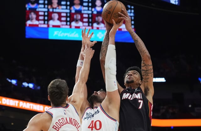 LA Clippers guard Bogdan Bogdanovic (10), center Ivica Zubac (40) and center Kel&#39;el Ware (7) go after a rebound during the first half of an NBA basketball game, Wednesday, March 12, 2025, in Miami. (AP Photo/Marta Lavandier)