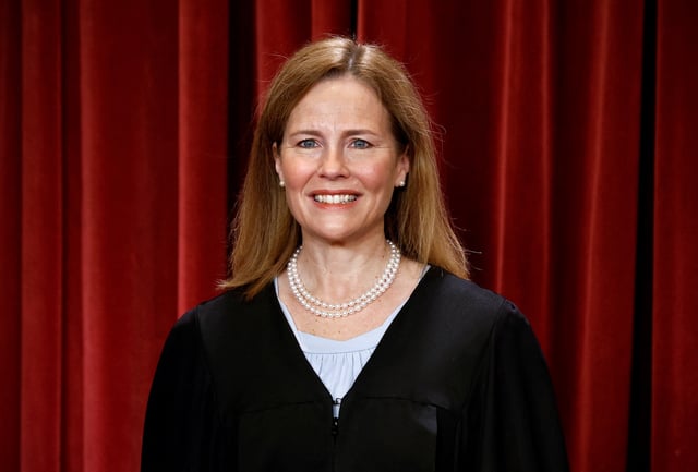 U.S. Supreme Court Associate Justice Amy Coney Barrett poses during a group portrait at the Supreme Court in Washington, U.S., October 7, 2022. REUTERS/Evelyn Hockstein/File Photo