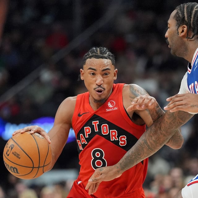 Philadelphia 76ers centre Andre Drummond (1) defends as Toronto Raptors guard Jared Rhoden (8) drives the ball up court during first half NBA basketball action in Toronto, Wednesday, March 12, 2025. THE CANADIAN PRESS/Frank Gunn