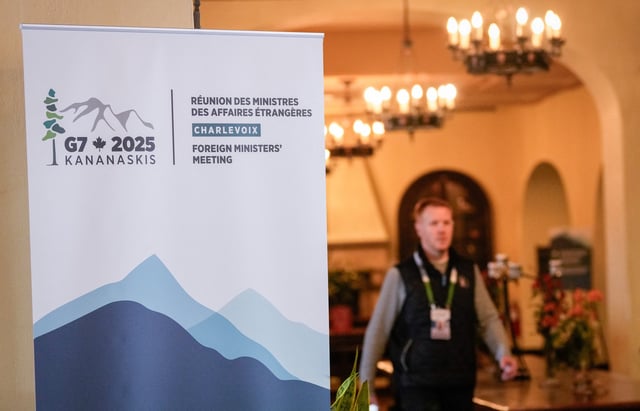 A man walks near the meeting room at the Manoir Richelieu before the G7 Foreign Ministers summit in La Malbaie, Quebec, Canada March 12, 2025.  REUTERS/Mathieu Belanger