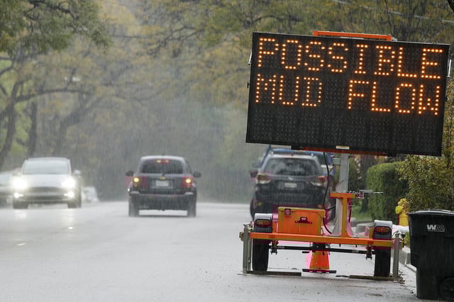 A sign reading 'Possible Mud Flow' on March 12, 2025, in Sierra Madre, California.