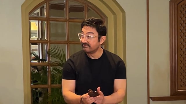 Aamir Khan feasts on a piece of cake during his birthday celebrations.